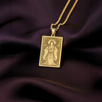 A handmade 14K gold plated rectangular necklace with a highly detailed engraving of the Japanese goddess Amaterasu Ōmikami. The artwork depicts the Shinto sun goddess in her role as the celestial ruler of the heavens.