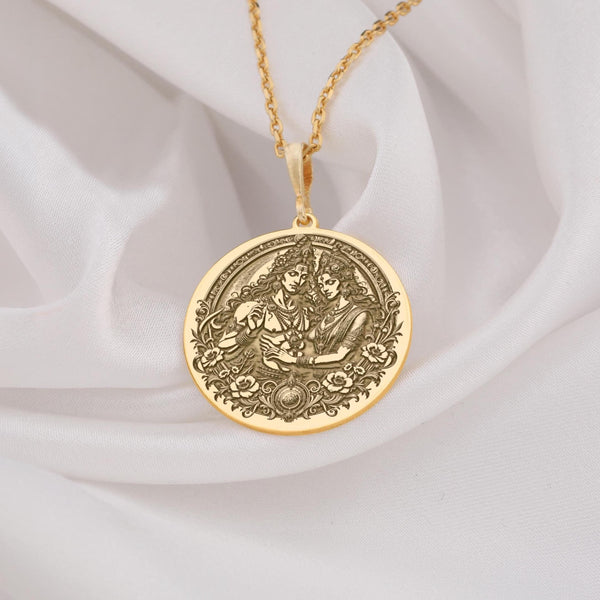 14k solid gold Shiva Parvati pendant necklace with intricate temple motifs, adorned with rubies and emerald accents on an adjustable chain