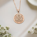 Elegant rose-plated silver Surya solar incarnation pendant with radiant charm, for light-embracers – explore this Vedic knotwork talisman now.