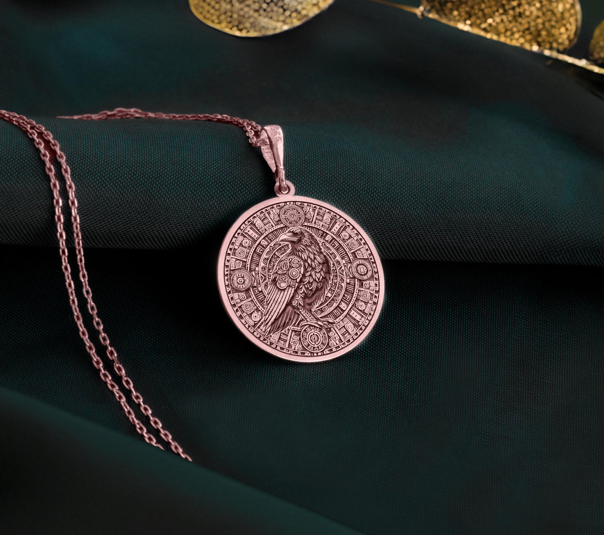 Rose Gold Plated Raven Pendant Necklace showcasing a Mayan-inspired Aztec calendar design. A meaningful jewelry gift for history and mythology admirers. A stylish accessory for any occasion.