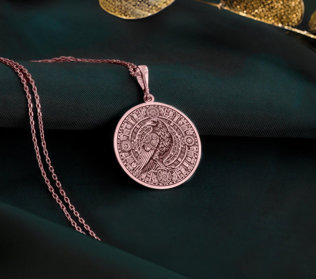 Rose Gold Plated Raven Pendant Necklace showcasing a Mayan-inspired Aztec calendar design. A meaningful jewelry gift for history and mythology admirers. A stylish accessory for any occasion.