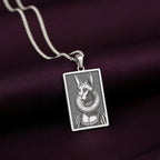 Sharp, detailed laser engraving of a Sphynx cat queen on a minimalist 925 sterling silver tag necklace, a perfect gothic accessory.