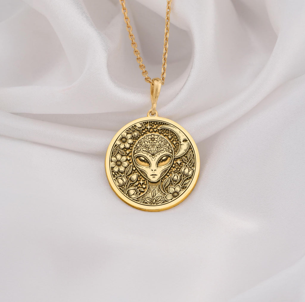 Mystical 14K gold alien pendant, featuring a detailed extraterrestrial medallion with floral cosmic engravings. A stunning sci-fi jewelry piece, perfect for space lovers, making it a unique gold cosmic charm.