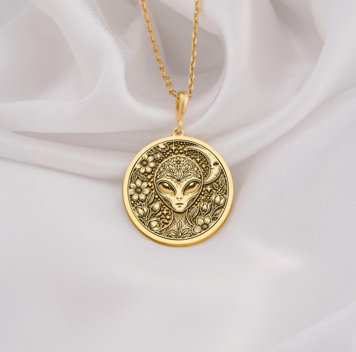 Mystical 14K gold alien pendant, featuring a detailed extraterrestrial medallion with floral cosmic engravings. A stunning sci-fi jewelry piece, perfect for space lovers, making it a unique gold cosmic charm.