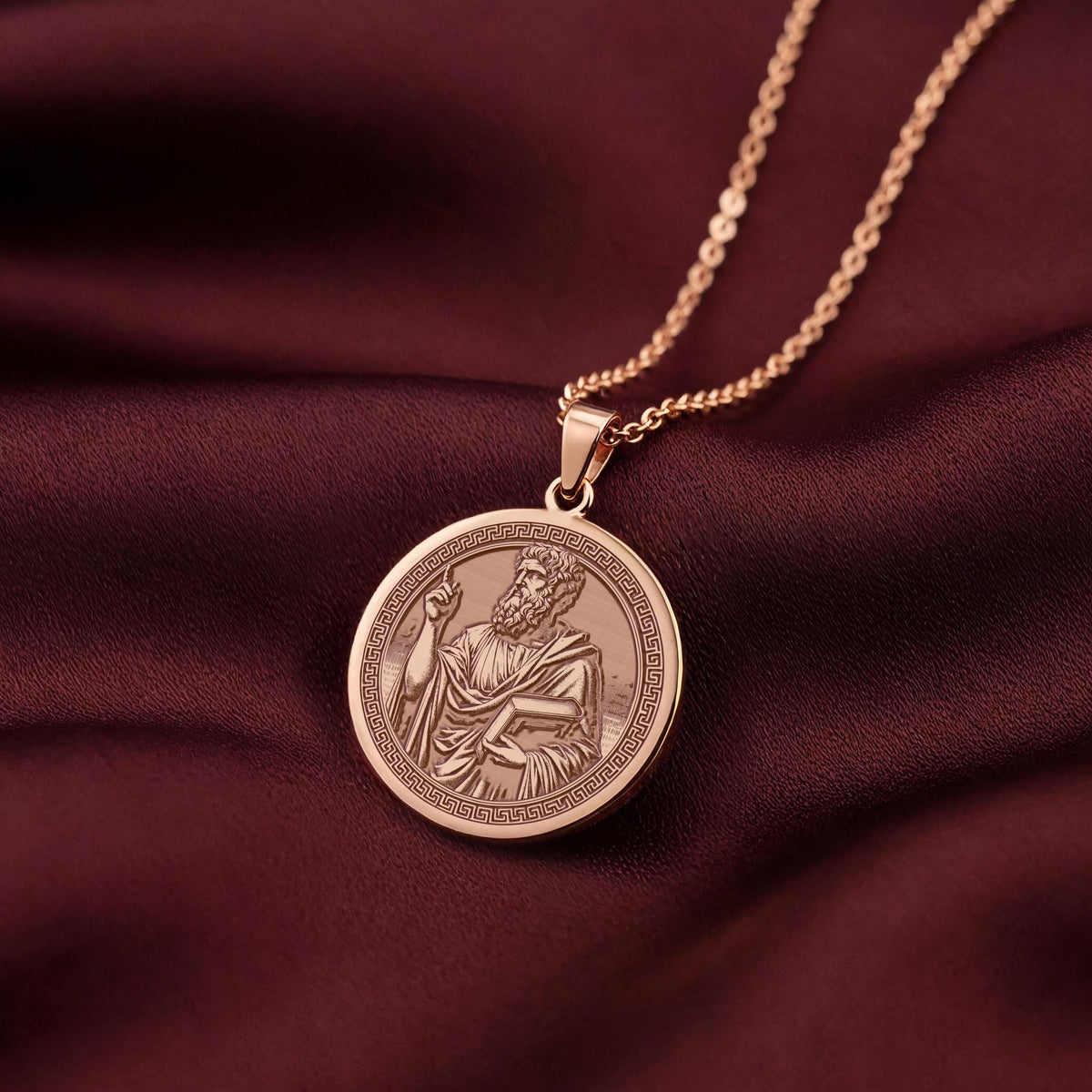 A custom rose gold plated philosopher coin. This piece is a perfect gift, celebrating the foundations of Western philosophy.