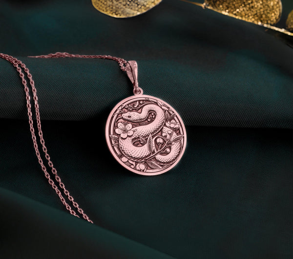 Rose gold plated snake necklace featuring a chic serpent charm. Handmade and versatile, this dainty jewelry piece is a great gift for her, offering a trendy and feminine touch to any outfit.