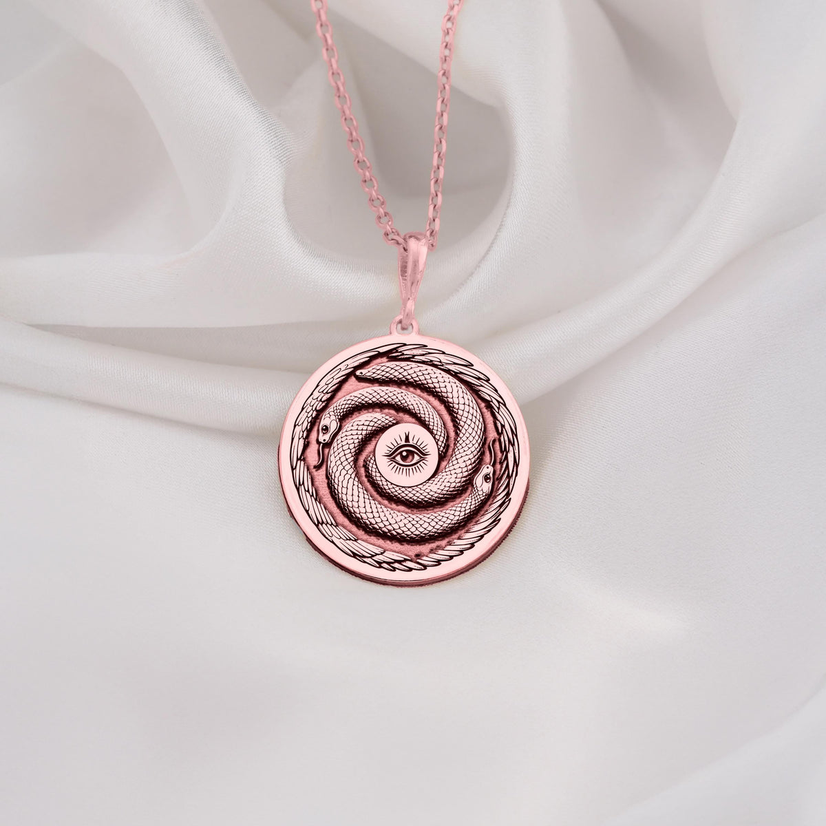 Rose Gold Plated Ouroboros Pendant with a beautiful snake motif representing renewal and infinite cycles. A perfect balance of elegance and symbolism for modern jewelry lovers.