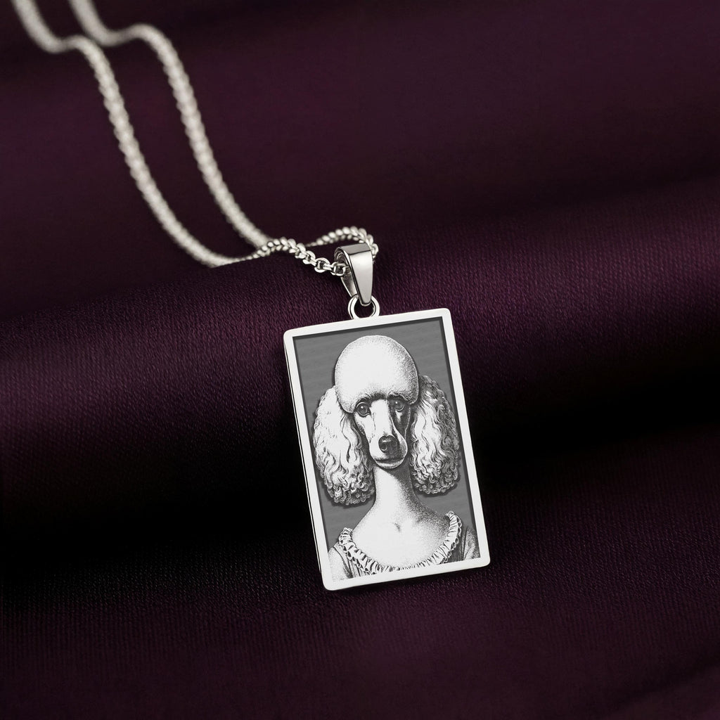 Sharp, detailed laser engraving of a Poodle on a minimalist 925 sterling silver tag necklace, a classic piece of pet jewelry.