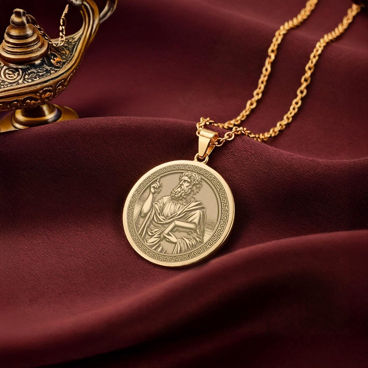 A polished 14K solid gold Plato pendant. This fine jewelry represents the quest for truth, making it a powerful gift for a student or teacher.