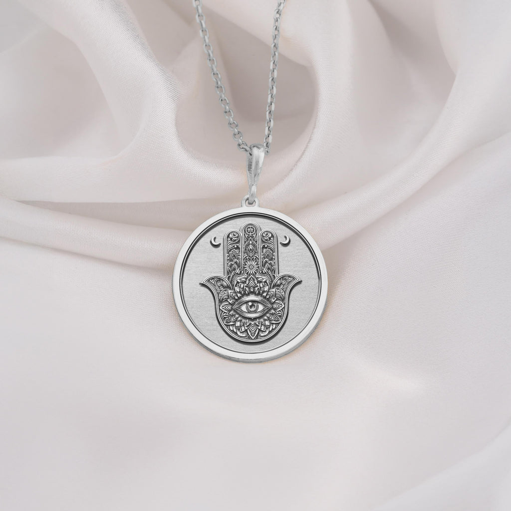 925 Sterling Silver Hamsa pendant with engraved evil eye symbol, symbolizing protection and blessings. Perfect silver amulet necklace for spiritual jewelry lovers and meaningful gifting.