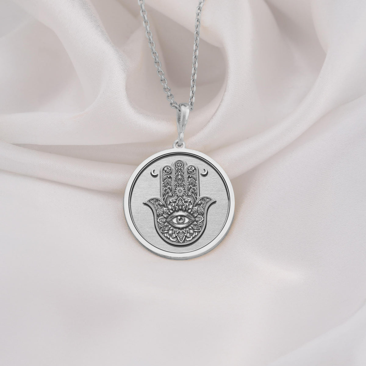 925 Sterling Silver Hamsa pendant with engraved evil eye symbol, symbolizing protection and blessings. Perfect silver amulet necklace for spiritual jewelry lovers and meaningful gifting.