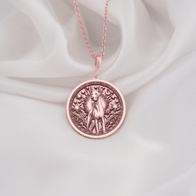 Rose Gold Plated Doberman Pinscher Medallion featuring noble breed with celestial rays and stars. Elegant pet memorial jewelry with cosmic symbols and sleek silhouette. Warm-toned dog talisman for guardian breed lovers.