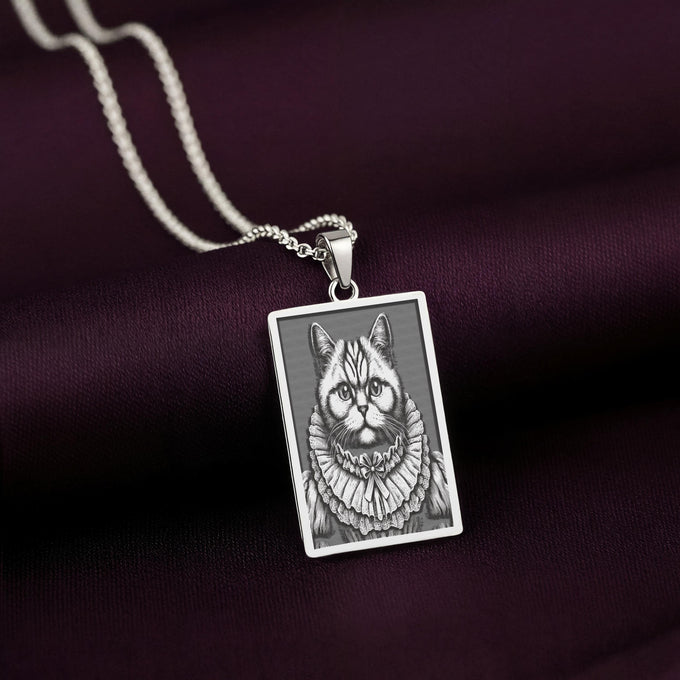 925 Sterling Silver version of The Ancestors Collection's British Shorthair necklace, with a cool tone contrasting against the rich purple fabric.