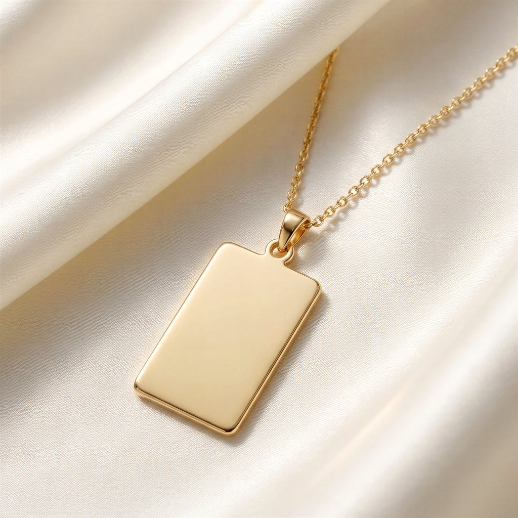 Custom Engravable Blank Rectangle Bar Pendant - 14K Solid Gold Editorial Close-Up on Ivory Mulberry Silk