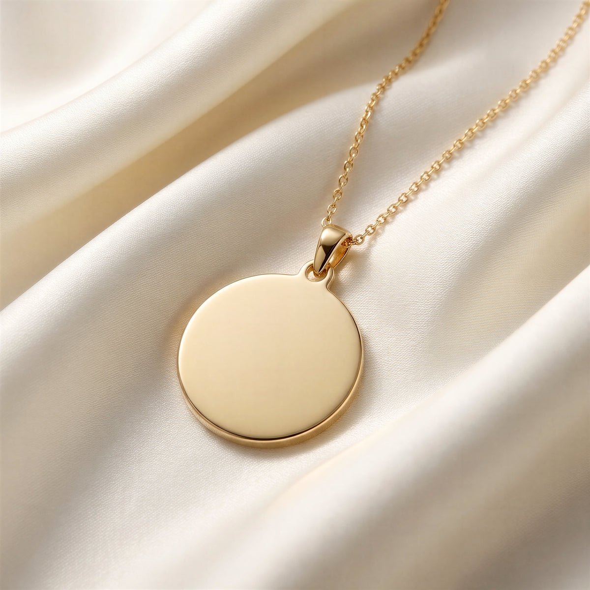 Custom Engravable Blank Coin Pendant - 14K Gold Plated Editorial Close-Up on Ivory Mulberry Silk