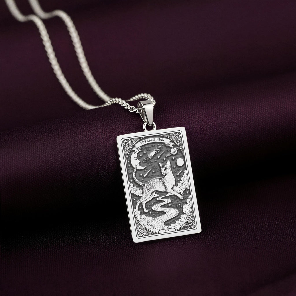A striking 925 sterling silver Abyssinian Cat charm. The art shows the celestial cat, a meaningful piece of witchy jewelry for her.