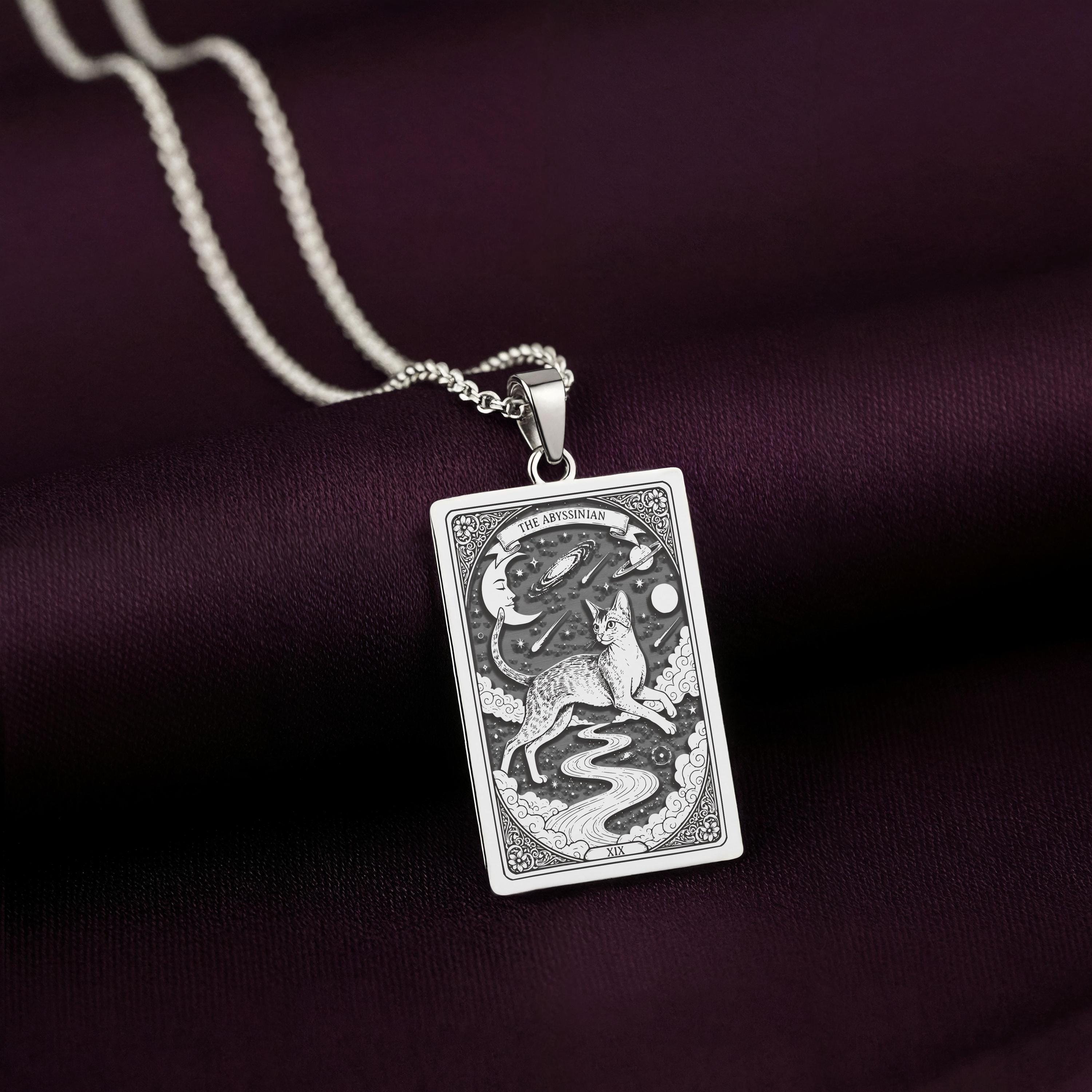 A striking 925 sterling silver Abyssinian Cat charm. The art shows the celestial cat, a meaningful piece of witchy jewelry for her.