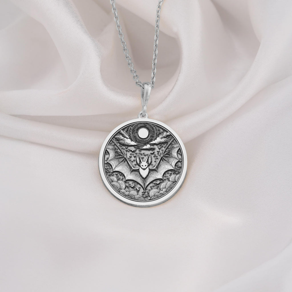 925 Sterling Silver Bat Pendant. Intricate 925 sterling silver bat pendant with a moon motif, ideal for unisex gothic jewelry and night inspired accessories.