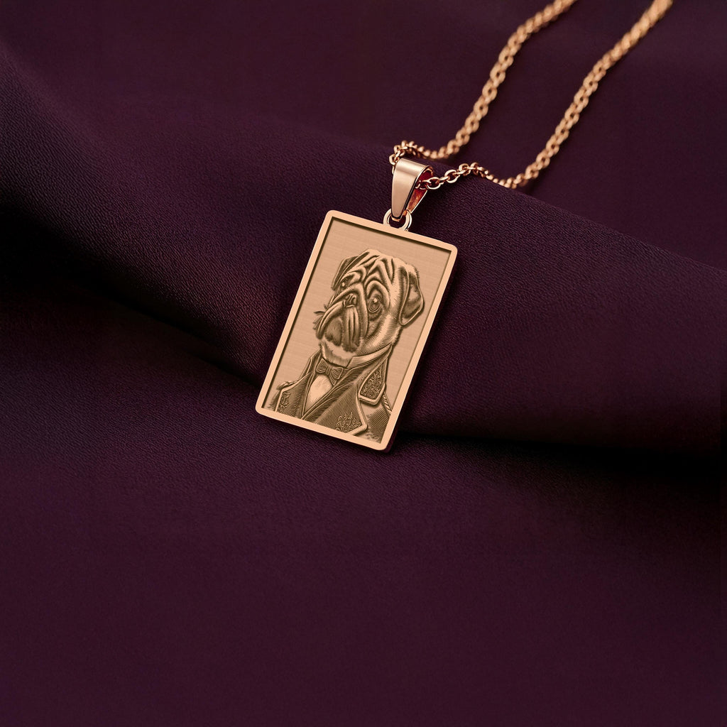 Personalized rose gold plated dog portrait necklace. The pendant shows a Pug dressed as a Victorian gentleman, created with precision laser engraving.
