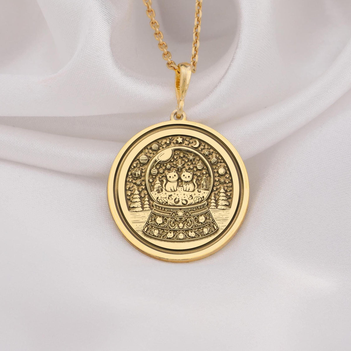 14K solid gold snow globe pendant featuring two cats inside a detailed coin-style medallion. Perfect gift for cat lovers and jewelry enthusiasts, handmade and adjustable for any outfit.