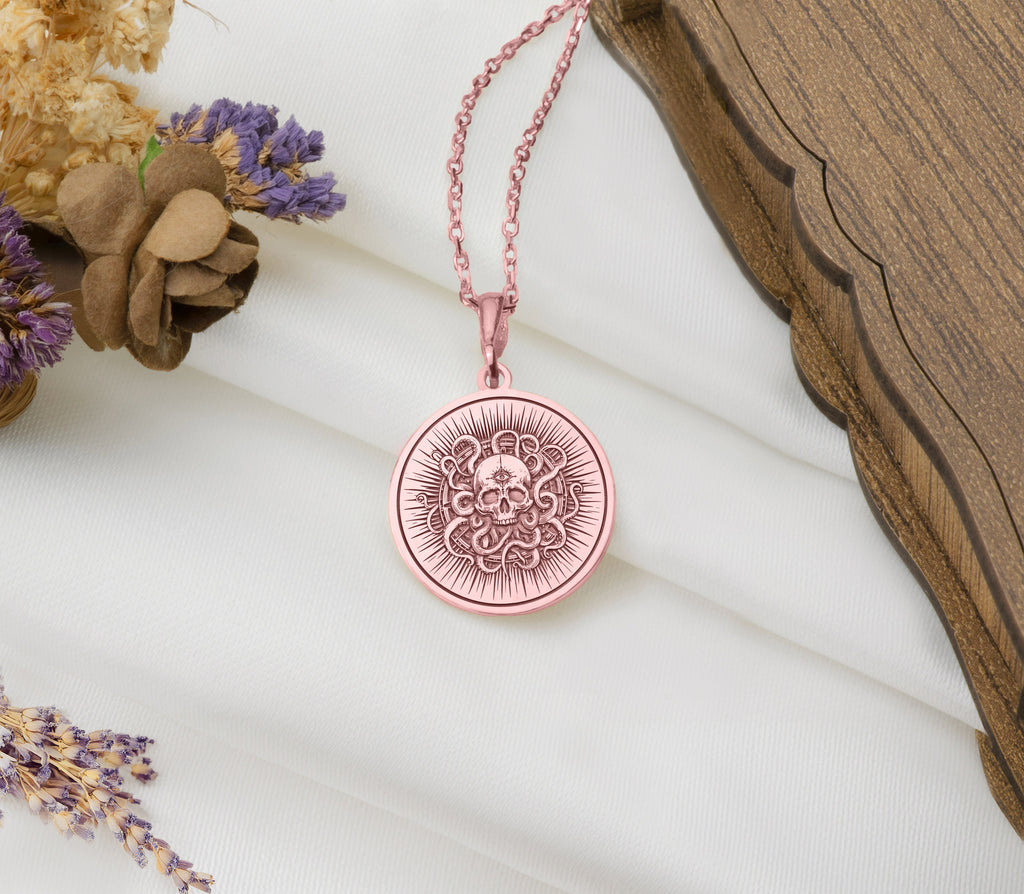 a pink necklace with a flower on it