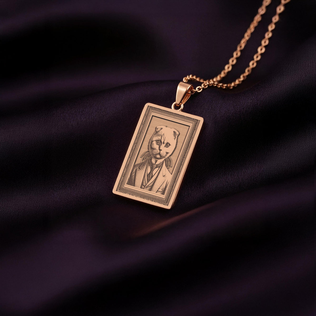A Rose Gold Plated Scottish Fold necklace, displaying its warm, pinkish hue. The engraved art features a cat with distinctive folded ears and a gentleman's suit.