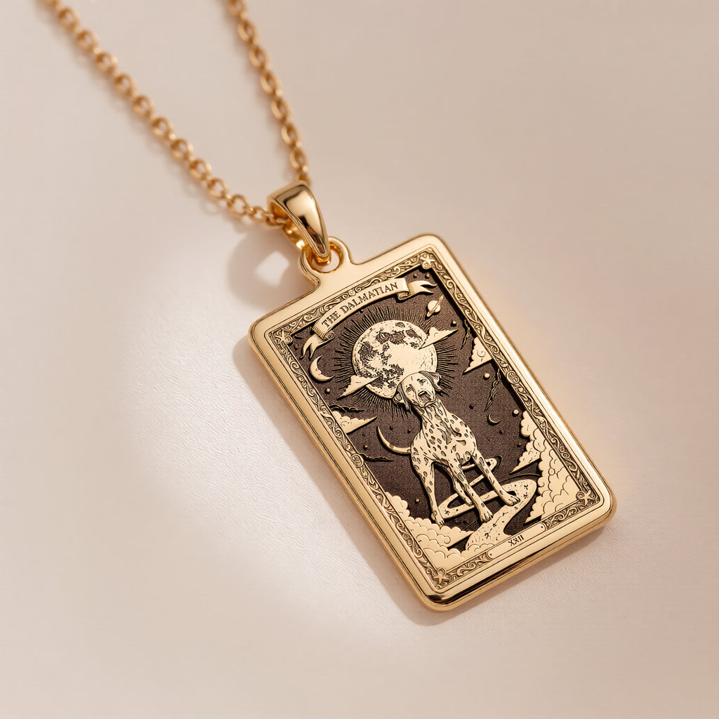 An heirloom-quality 14K solid gold Dalmatian tarot pendant. The art shows the spotted dog under the moon, symbolizing loyalty, a precious dog mom gift.