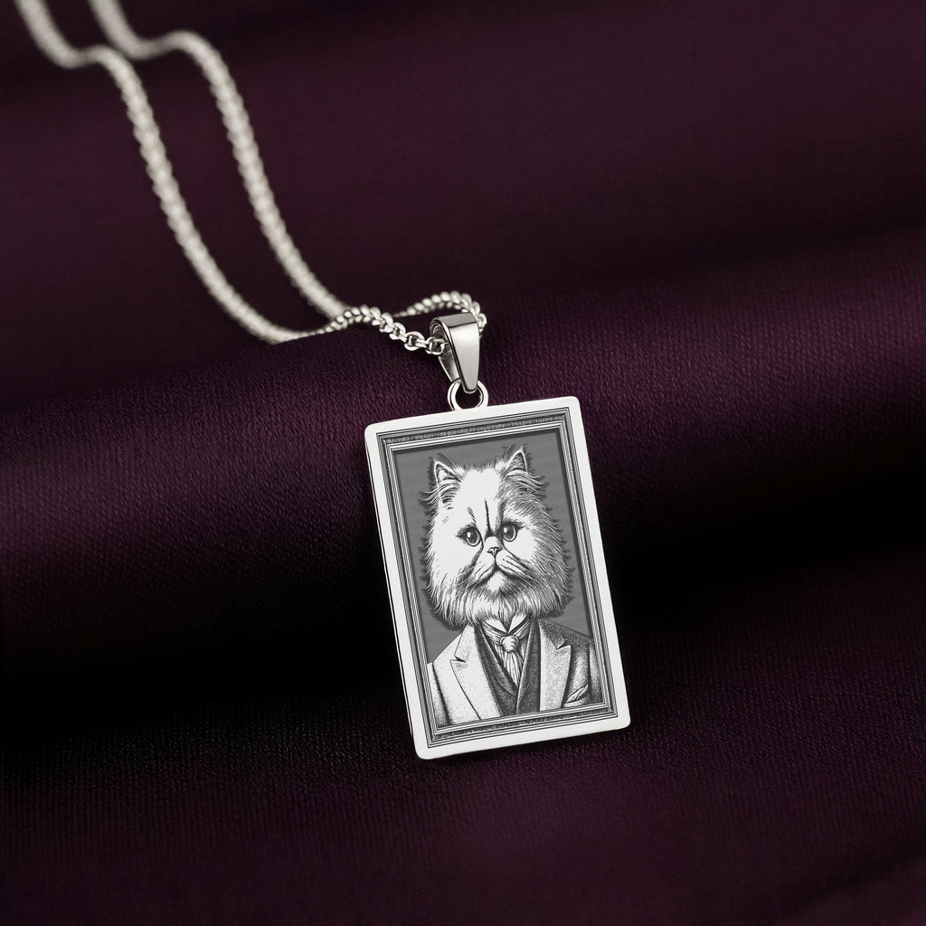 Another perspective of the 925 Sterling Silver Persian Cat necklace, with the lighting emphasizing the texture of the engraved waistcoat and the grumpy, yet regal, face.
