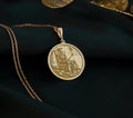Front view of Skeleton King Throne Pendant in 14K solid gold, showing an engraved skeleton king seated on a throne with skulls at the base.