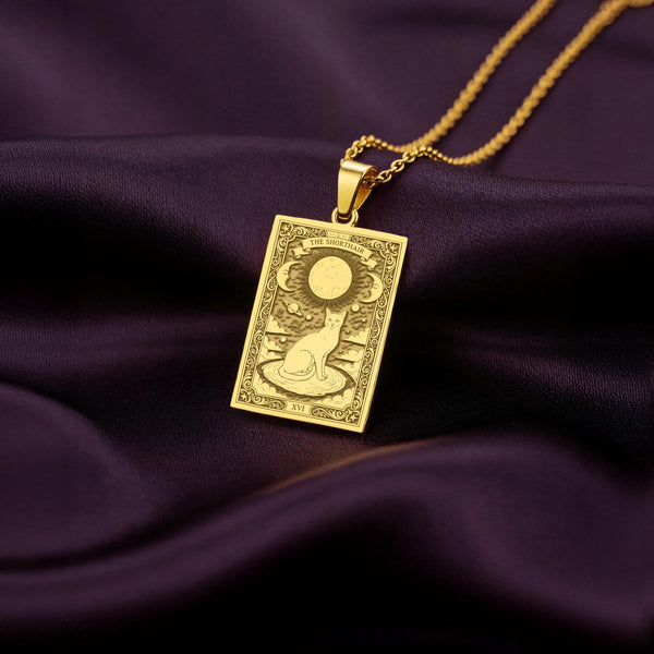A polished 14K solid gold Shorthair Cat medallion. This fine pet jewelry represents the breed's mystical nature, making it a perfect witchy gift.