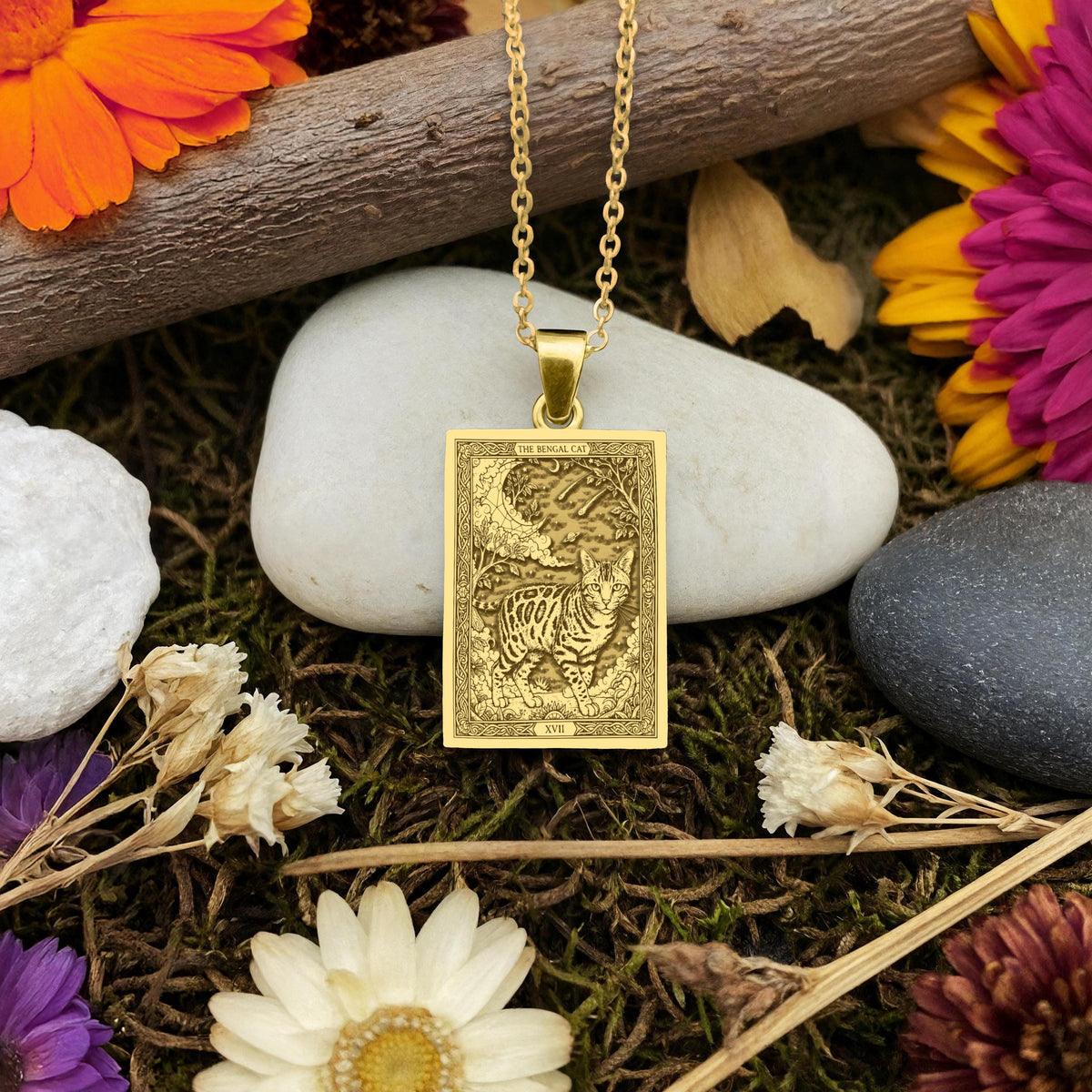 A handmade 14K gold plated Bengal Cat necklace. The engraving captures the leopard-like cat in a mystical tarot card style.