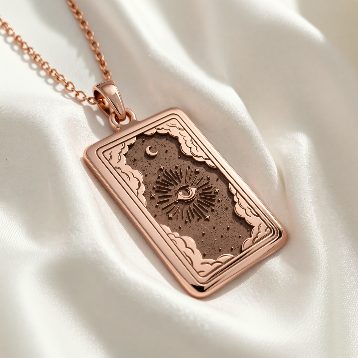 Rose gold plated Eye Tarot Necklace pendant with engraved all-seeing eye, sun rays, stars and crescent moon.