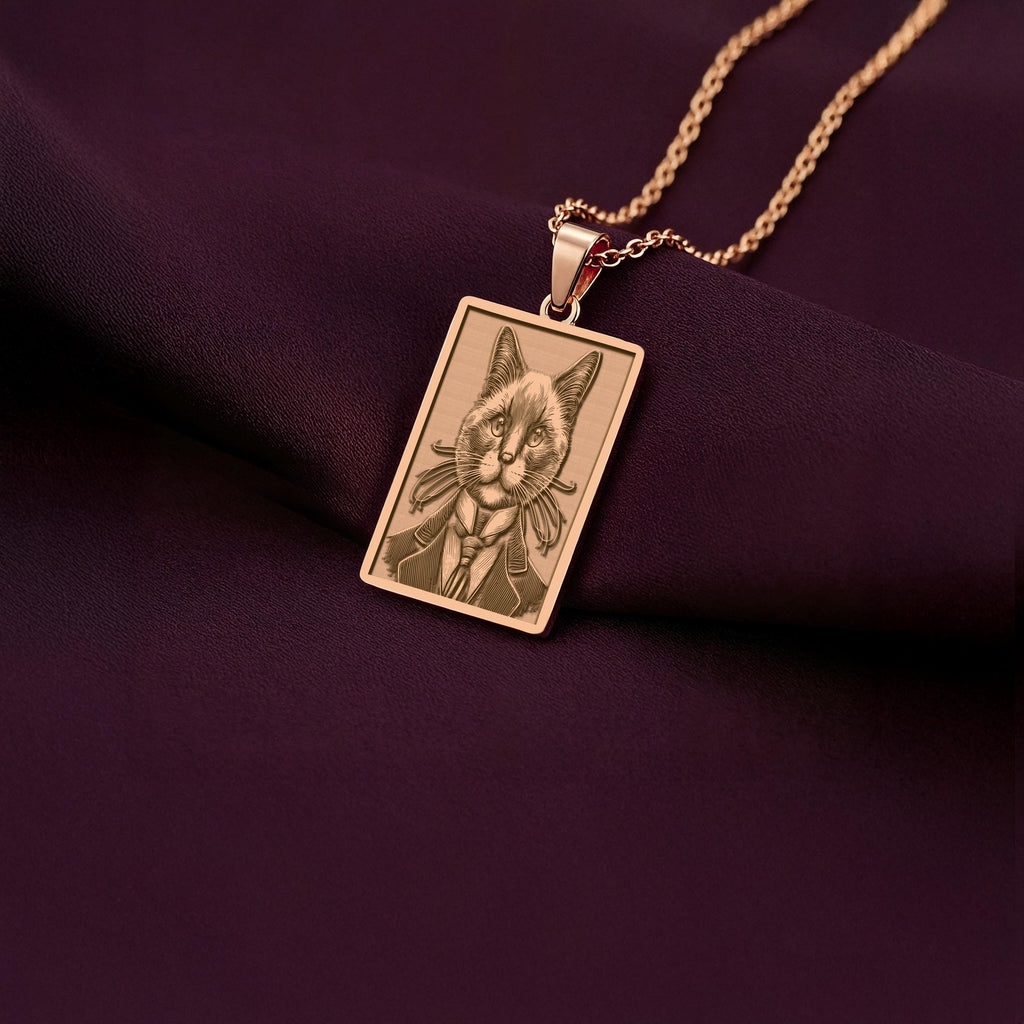 Personalized rose gold plated cat portrait necklace. The pendant shows a dapper Siamese cat created with precision laser engraving.