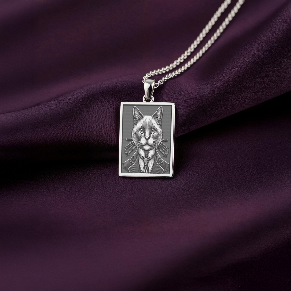 A polished 925 sterling silver rectangle pendant with a custom laser-etched portrait of a gentleman Siamese cat, ideal as a unique cat lover gift.