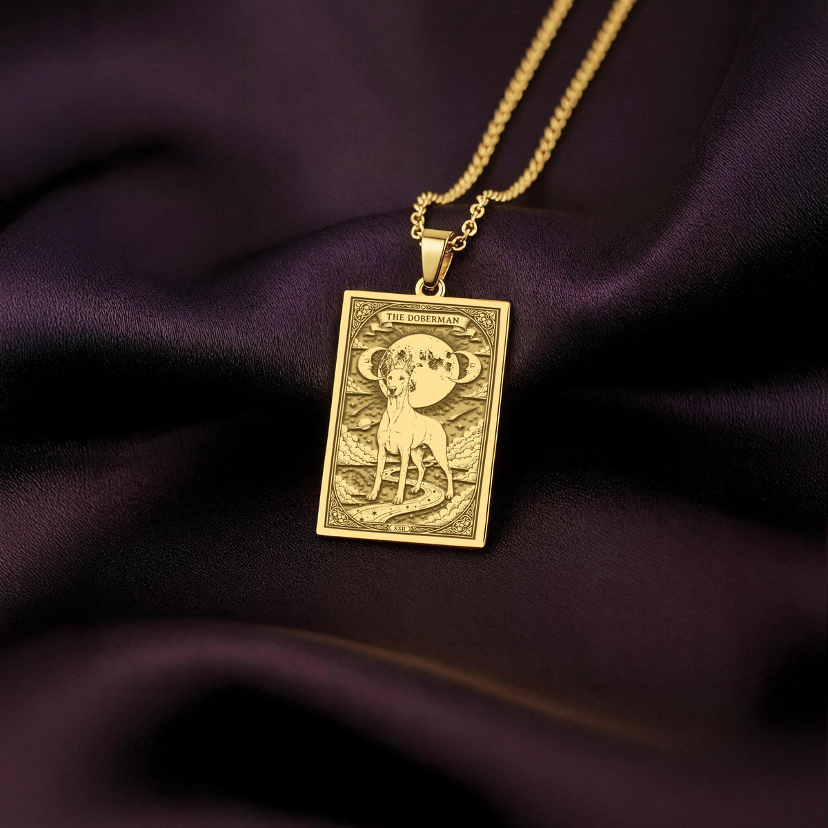 An heirloom-quality 14K solid gold Doberman tarot pendant. The art shows the elegant dog under the moon, symbolizing a loyal guardian, a precious dog mom gift.