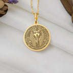 Yellow gold Tutankhamun coin pendant necklace, inspired by ancient Egypt. This dainty 14k gold charm symbolizes royalty and resilience, perfect for layering or daily wear. A unique, lightweight gift blending timeless elegance and boho style.