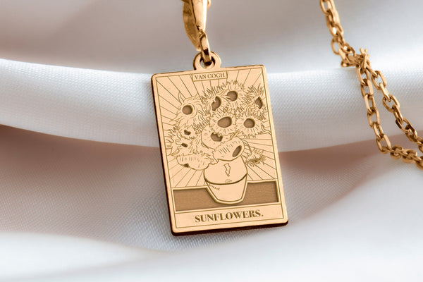 There isn&#39;t actually a necklace painted in Van Gogh&#39;s famous Sunflower paintings. Van Gogh himself created still lifes featuring sunflowers in vases. These vibrant flowers are a recurring theme in his work.