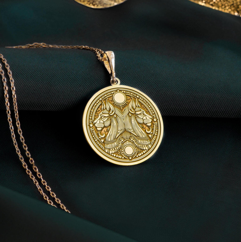 14K solid gold Egyptian Aker necklace with a double lion design, symbolizing protection and balance. Handmade unisex mythology jewelry inspired by ancient Egypt.