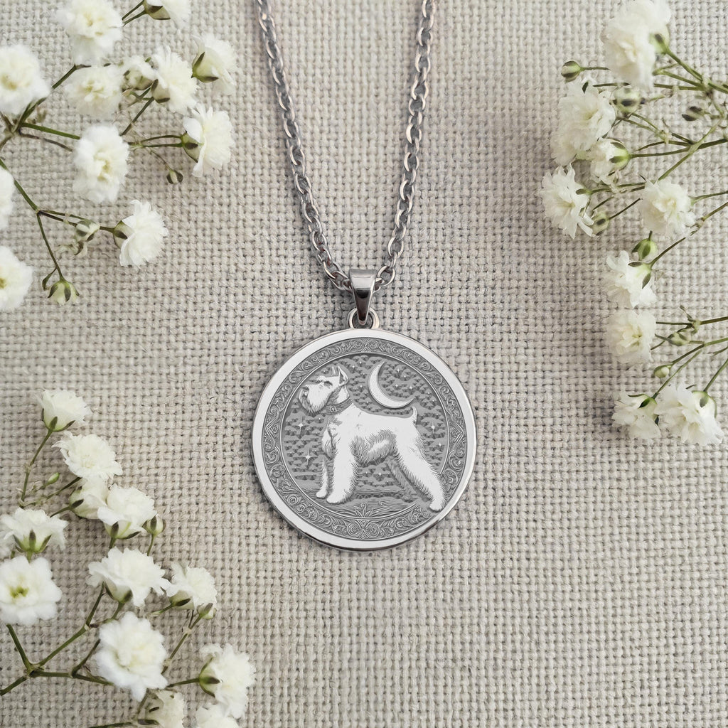 Sterling Silver Schnauzer coin necklace charm showing a finely detailed portrait of the beloved dog breed. Handcrafted pet memorial jewelry with an artistic, classic design. An ideal keepsake gift for any dog lover or Schnauzer mom
