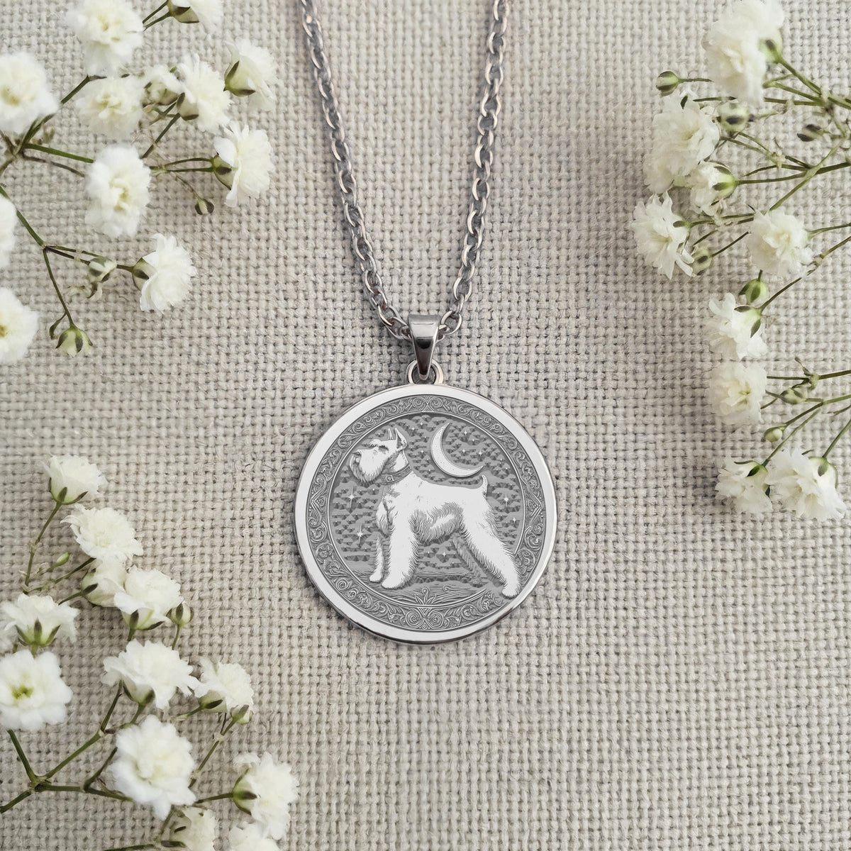 Sterling Silver Schnauzer coin necklace charm showing a finely detailed portrait of the beloved dog breed. Handcrafted pet memorial jewelry with an artistic, classic design. An ideal keepsake gift for any dog lover or Schnauzer mom
