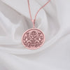 rose gold plated Surya necklace featuring a detailed pendant of the Hindu sun god, Surya, with intricate solar rays design. Crafted with rose gold plating, this mythological-inspired jewelry piece symbolizes light, energy, and divine protection. Ideal for those seeking Hindu cultural jewelry or a unique sun-themed accessory. The pendant depicts Surya riding his chariot, pulled by seven horses, with lotus flowers in hand, radiating warmth and enlightenment.&quot;