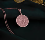a necklace with a picture of a woman on it