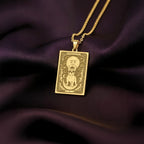 An heirloom-quality 14K solid gold French Bulldog tarot pendant. The art shows the Frenchie under a moon-face, symbolizing its comical spirit, a precious dog mom gift.