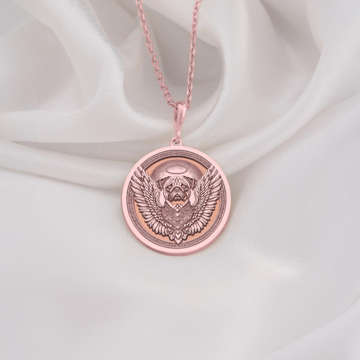 Rose Gold Plated Pug Angel Dog Medallion featuring beloved small breed with heavenly wings and halo. Memorial jewelry with detailed wrinkled face and ornate decorative border. Warm-toned rainbow bridge talisman, perfect comfort gift for Pug loss.