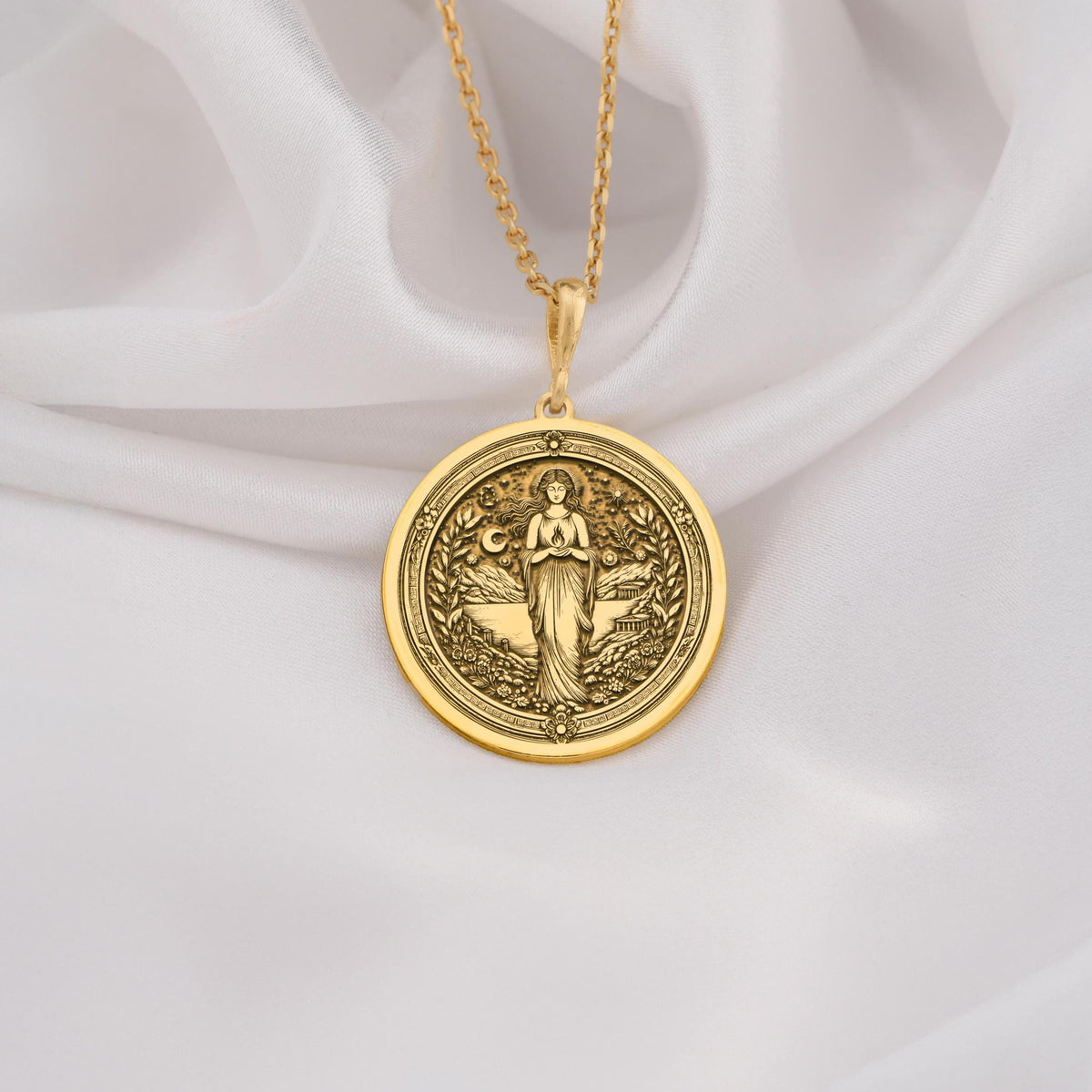 Hestia Goddess Hearth Pendant Necklaces 14K 14K Gold Plated round pendant featuring a draped winged female figure design.