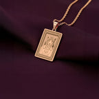An elegant rose gold plated tarot card pendant depicting a jaguar portrait. This engraved piece is a tribute to Mayan and Aztec mythology, a perfect piece of wearable art.
