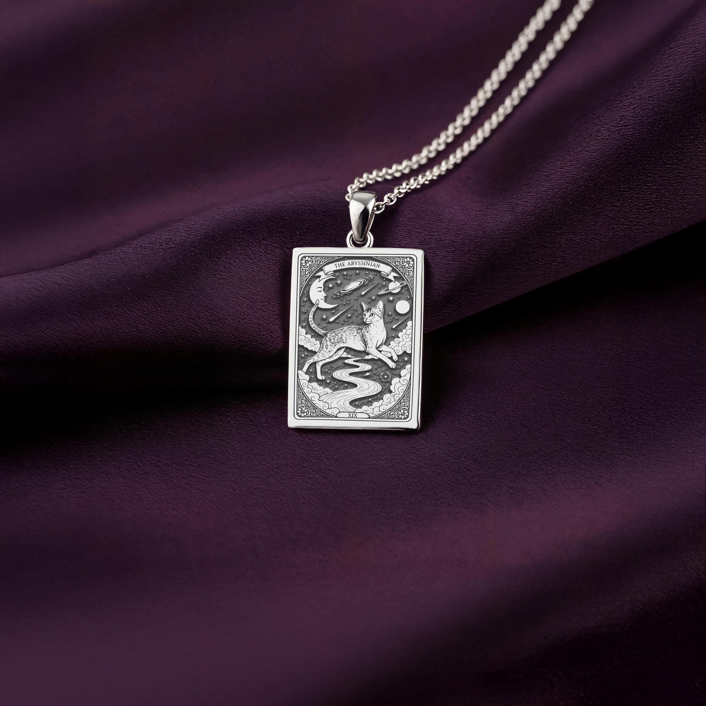 A personalized 925 sterling silver Abyssinian Cat necklace. This gift celebrates the adventurous spirit of the breed, a cherished pet memorial keepsake.