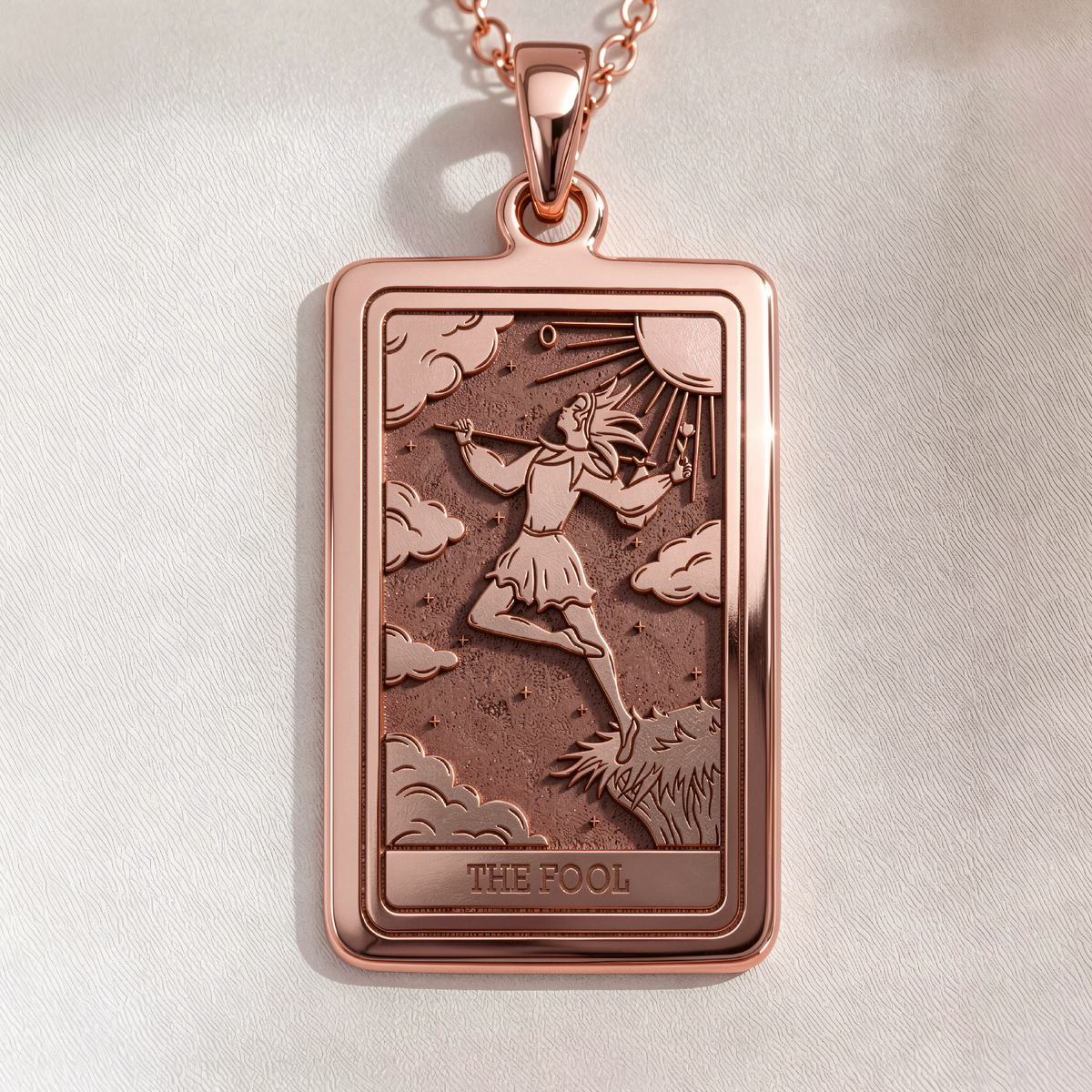 The Fool Tarot Pendant in a polished rose gold finish.
