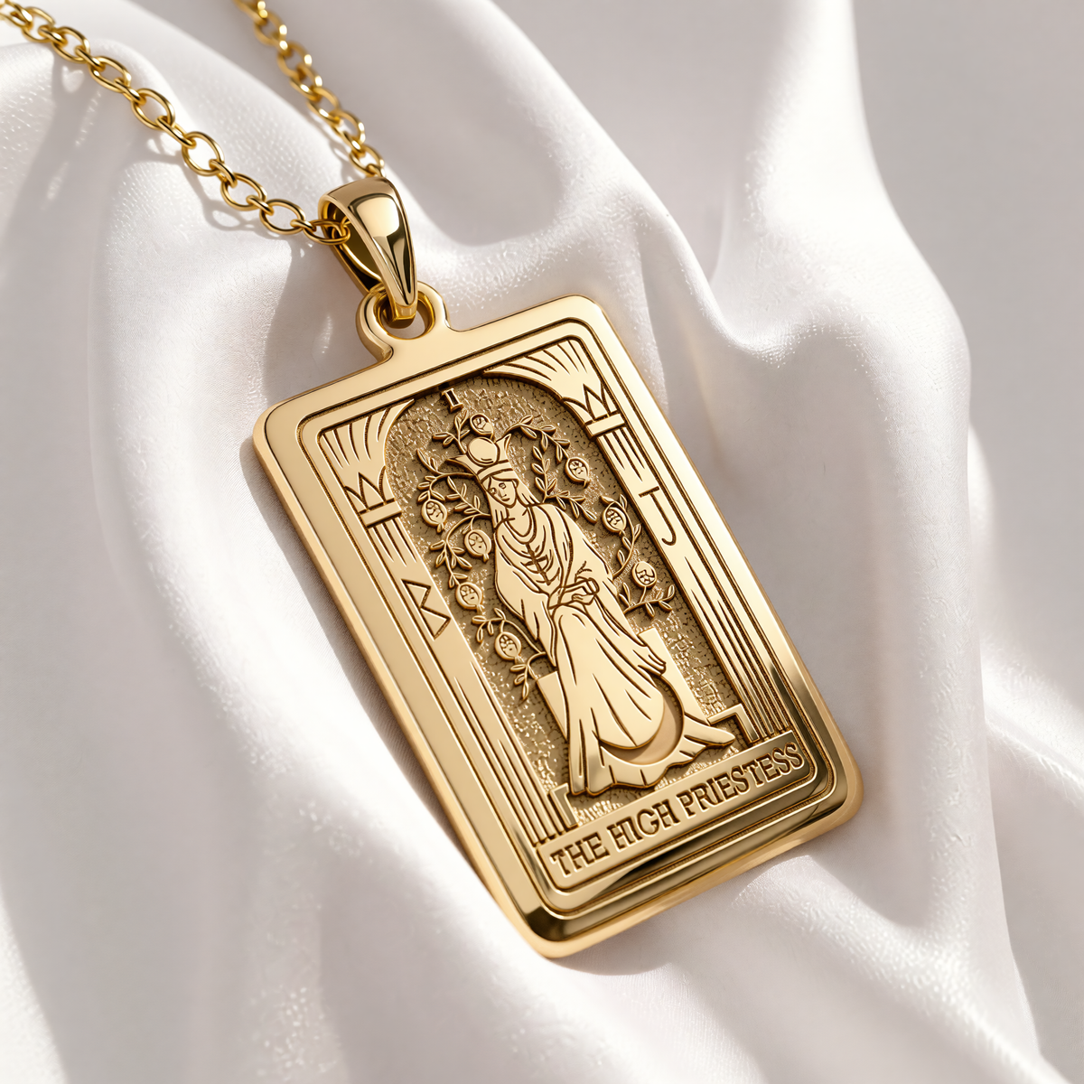 High Priestess Tarot Necklace pendant in gold plated finish, front view of rectangular medallion with engraved High Priestess figure between columns.