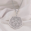 Silver pendant necklace featuring a detailed lotus flower design with intricate filigree details and a smooth surface finish. The pendant hangs from a delicate chain, viewed from the front.
